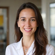 A friendly, professional nutritionist smiling warmly